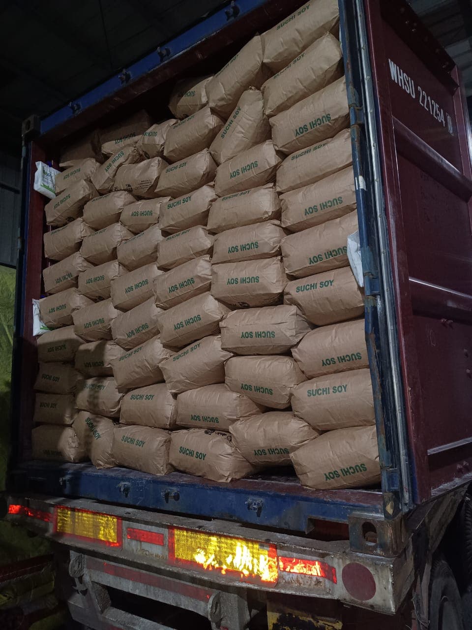 Suchi Soy branded bags stacked inside an export container